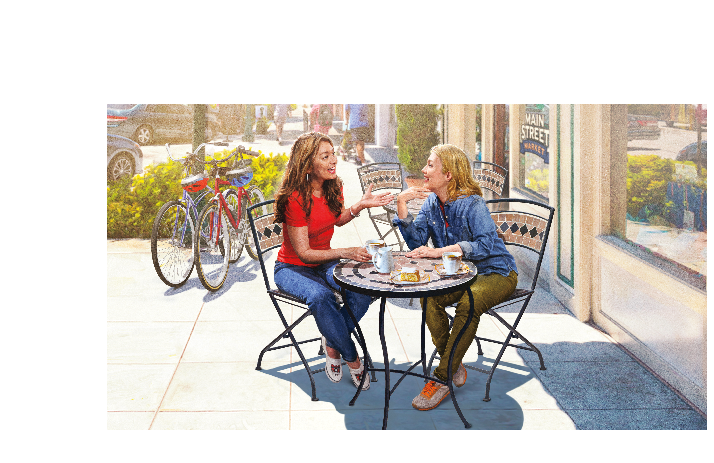 Two women sitting outside having lunch